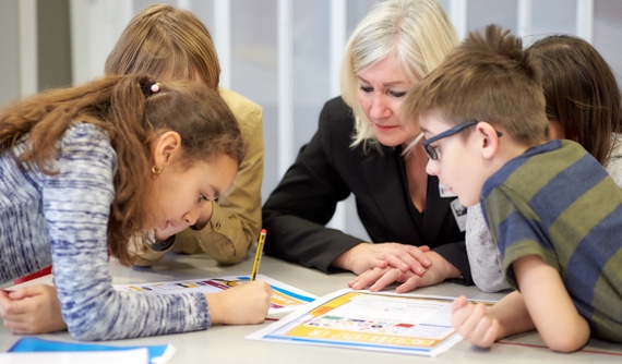 A bank employee with a group of students