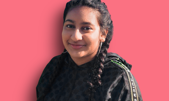 Social science student Khushi, 19, smiles for the camera